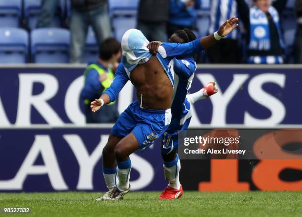 Charles N'Zogbia of Wigan Athletic celebrates with Victor Moses after scoring the winning goal during the Barclays Premier League match between Wigan...