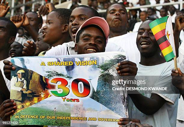 Zimbabweans cheer on the nation's independence celebrations in Harare at the National Sports Stadium on April 18, 2010. President Robert Mugabe...