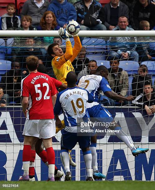 Lukasz Fabianski of Arsenal fails to collect the ball before Titus Bramble of Wigan Athletic scores the equalizing goal during the Barclays Premier...