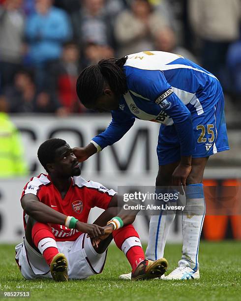 Mario Melchiot of Wigan Athletic consoles Emmanuel Eboue of Arsenal after the Barclays Premier League match between Wigan Athletic and Arsenal at the...