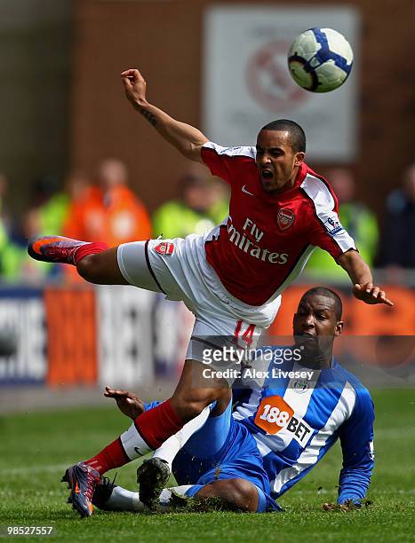 Theo Walcott of Arsenal is fouled by Titus Bramble of Wigan Athletic during the Barclays Premier League match between Wigan Athletic and Arsenal at...