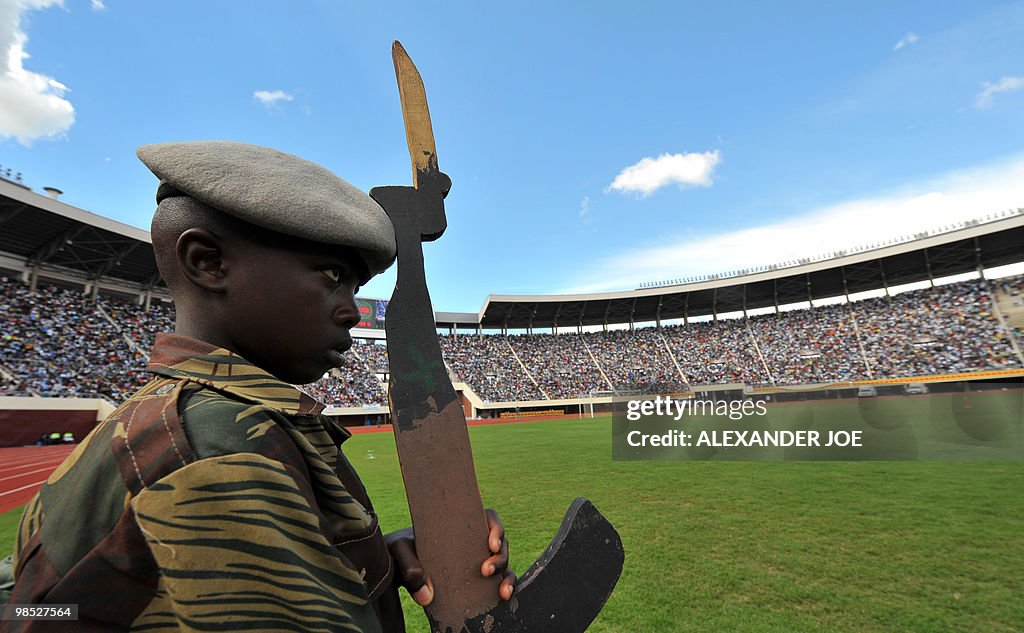 Zimbabwe Rattle A young Zimbabwean soldier carrying a fake gun parades in Harare at ...