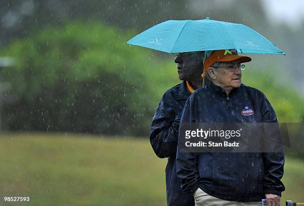 Two volunteers take cover in the rain at the third tee box during the final round of the Outback Steakhouse Pro-Am at TPC Tampa Bay on April 18, 2010...
