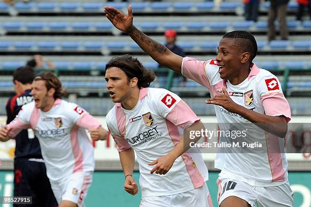 Abel Hernandez of Palermo and his team-mates Federico Balzaretti and Nicolas Bertolo celebrate the equalizing goal during the Serie A match between...