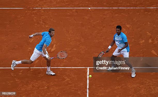 Max Mirnyi of Belarus and Mahesh Bhupathi of India in action against Nenad Zimonjic of Serbia and Daniel Nestor of Canada during day Seven of the ATP...
