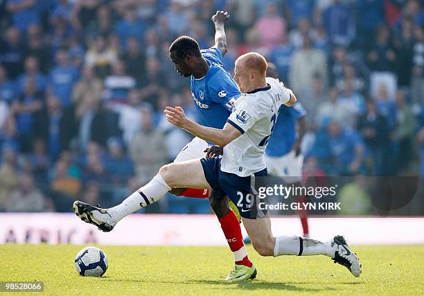 Portsmouth's Nigerian striker John Utaka vies with Aston Villa's Welsh defender James Collins during their English Premier League football match...