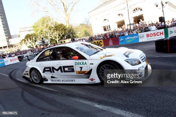 Mercedes driver Ralf Schumacher of Germany steers his car during the presentation of the German Touring Car Championship DTM in front of the Kurhaus...