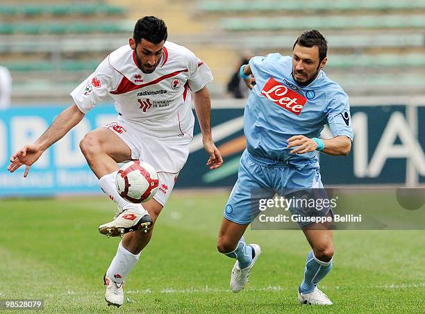 Nicola Belmonte of Bari and Andrea Dossena of Napoli in action during the Serie A match between AS Bari and SSC Napoli at Stadio San Nicola on April...