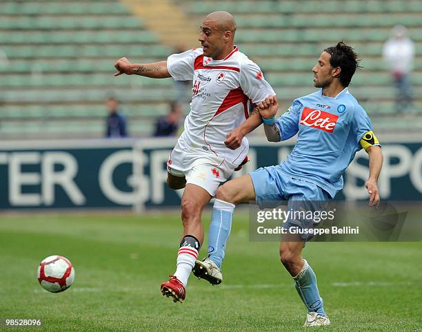 Sergio Almiron of Bari and Gianluca Grava of Napoli in action during the Serie A match between AS Bari and SSC Napoli at Stadio San Nicola on April...