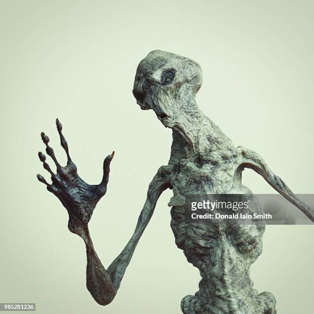 weird creature - grey aliens stock pictures, royalty-free photos & images