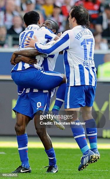 Raffael of Berlin celebrates after scoring his team's second goal with team mates during the Bundesliga match between Eintracht Frankfurt and Hertha...