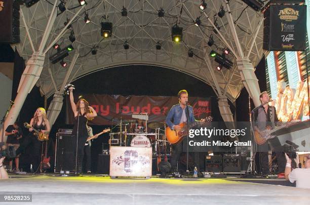 Cheyenne Kimball, Rachel Reinert, Tom Gossin and Mike Gossin of Gloriana perform on Fremont Street on April 17, 2010 in Las Vegas, Nevada.