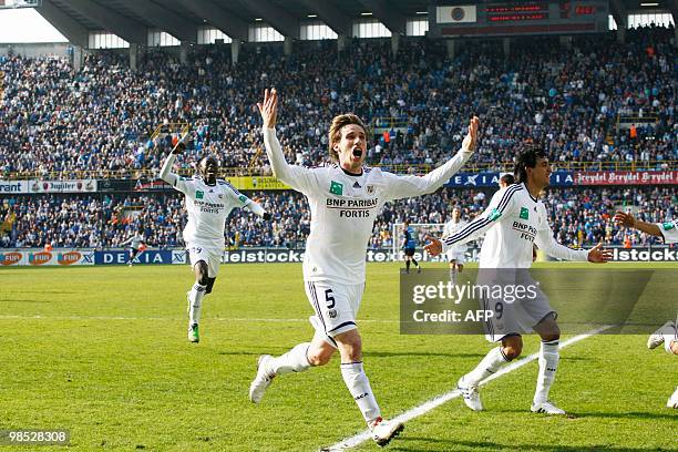 Anderlecht's Bakary Sare, Lucas Biglia and Matias Suarez celebrate after winning 1-2 the Belgian first division football match between Club Brugge...