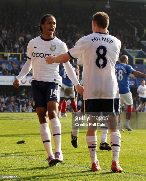 Nathan Delfouneso of Aston Villa celebrates his goal with team mate James Milner during the Barclays Premier League match between Portsmouth and...