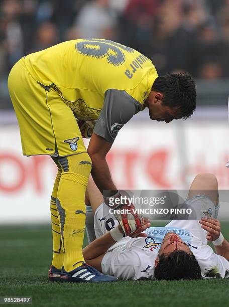 Lazio's defender Guglielmo Stendardi lies on the field after clashing with AS Roma's forward Luca Toni during their Serie A football match at Olympic...
