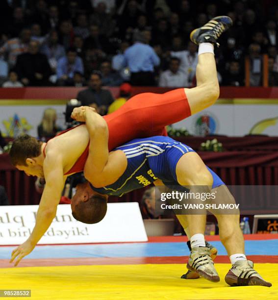 French Melonin Noumonvi competes for the bronze with Croatian Nenad Zugaj during men's Free Style Wrestling 84 kg event at the Senior Wrestling...