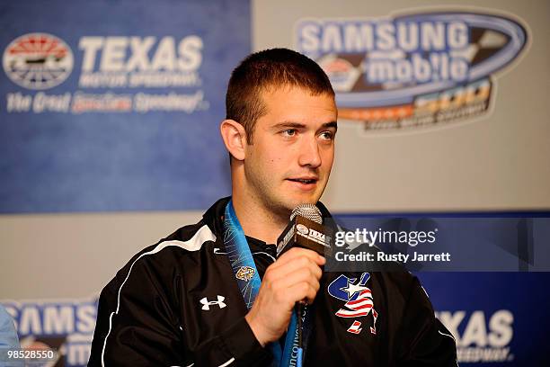 Winter Olympics Bobsledding Gold Medalist Justin Olsen speaks with the media at a press conference prior to the NASCAR Sprint Cup Series Samsung...