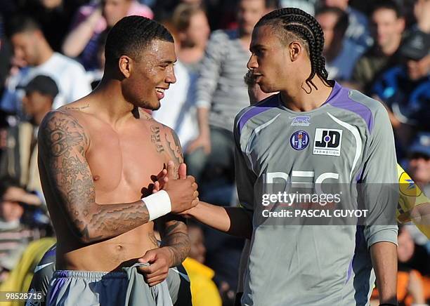 Toulouse's forward Colin Kazim-Richards is congratuled by teammate Etienne Capoue after scoring a goal during the French L1 football match...