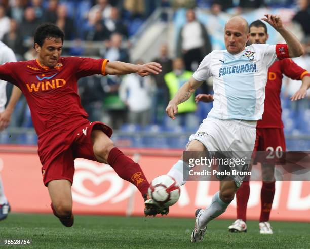 Tommaso Rocchi of SS Lazio and Nicolas Burdisso of AS Roma compete for the ball during the Serie A match between SS Lazio and AS Roma at Stadio...