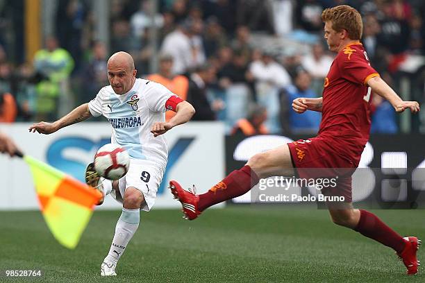 Tommaso Rocchi of SS Lazio and John Arne Riise of AS Roma compete for the ball during the Serie A match between SS Lazio and AS Roma at Stadio...