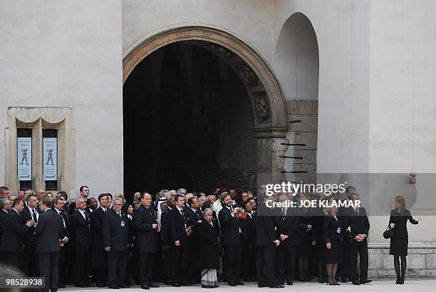 Guests wait in line on April 18, 2010 to present and sign the book of condolences during a funeral ceremony at Wawel Castle in Krakow for late Polish...