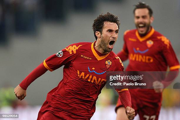 Mirko Vucinic of AS Roma celebrates after scoring the second goal during the Serie A match between SS Lazio and AS Roma at Stadio Olimpico on April...
