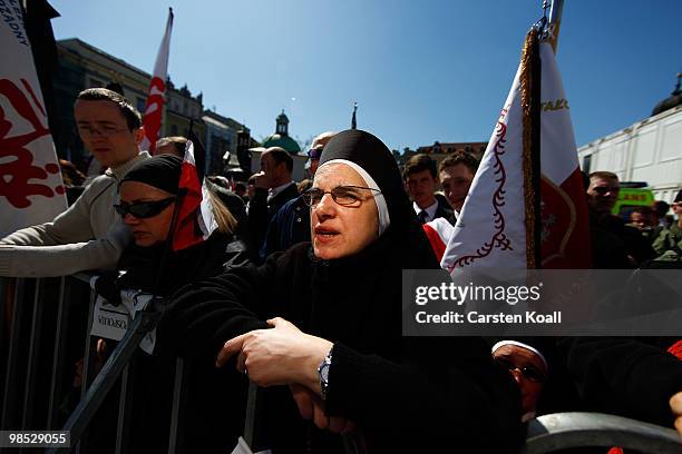 Nuns waiting for the religious and military procession wich transports the coffin of late Polish President Lech Kazcynski from the St Mary's Basilica...