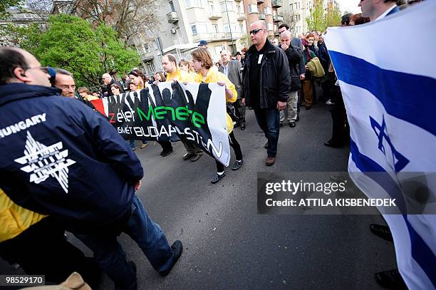 Activists hold a banner 'The rally of the Life in Budapest again' and the Jewish flag on a road nears the banks of Danube River in central Budapest...