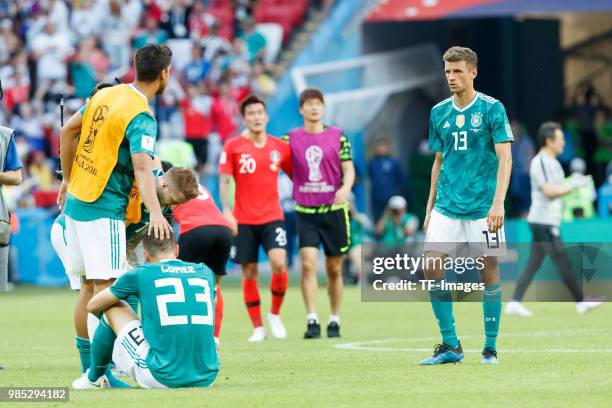 Sami Khedira of Germany, Mario Gomez of Germany and Thomas Mueller of Germany look dejected after the 2018 FIFA World Cup Russia group F match...