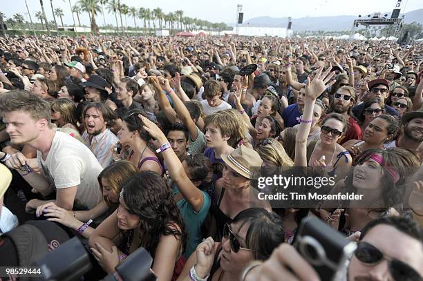 Fans watch Edward Sharpe and the Magnetic Zeros perform at Coachella Valley Music and Arts Festival at the Empire Polo Fields on April 17, 2010 in...