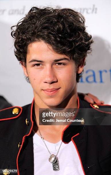 Singer Nick Jonas poses for a photo backstage at the 11th Annual T.J. Martell Foundation Family Day benefit at Roseland Ballroom on April 18, 2010 in...