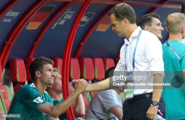 Team manager of Germany Oliver Bierhoff consoles Thomas Mueller following the 2018 FIFA World Cup Russia group F match between Korea Republic and...