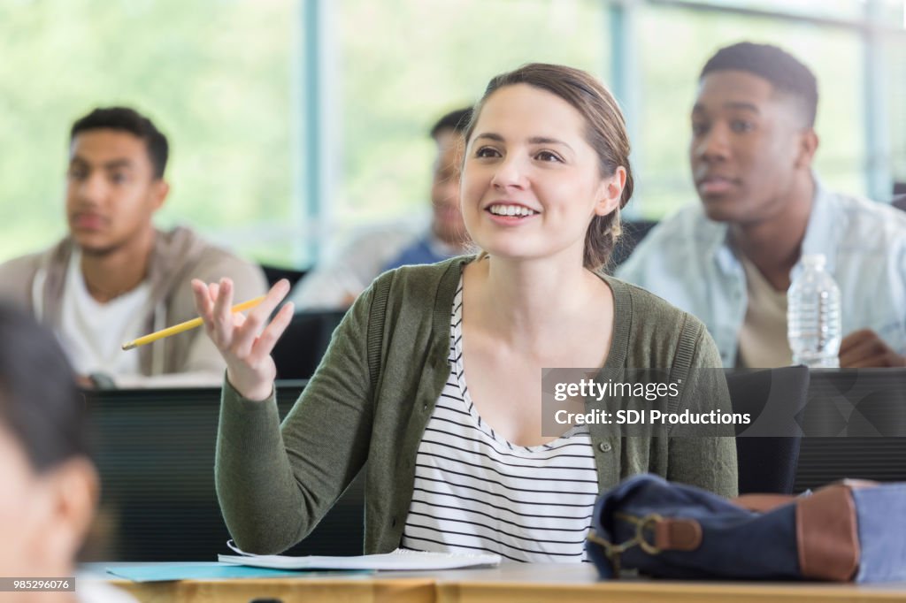 Female Question Female College Student Asks Question During Class High-Res Stock Photo ...