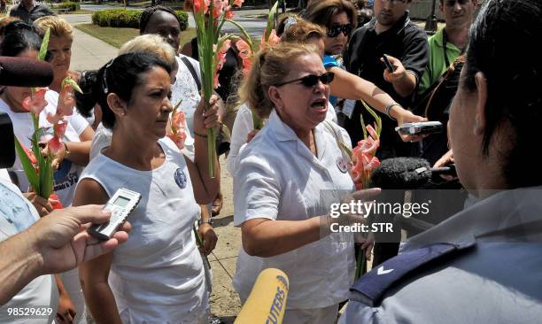 Cuban Ladies in White leader Laura Pollan , shouts anti-government slogans, on April 18 during a march along 5th Avenue in Havana, heckled by...