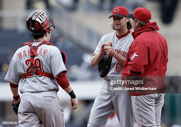 Bronson Arroyo, Ryan Hanigan, and Bryan Price of the Cincinnati Reds talk at the mound against the Pittsburgh Pirates during the game on April 18,...