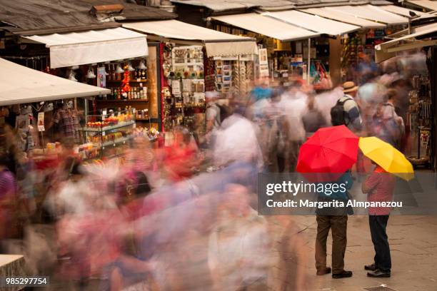 busy evening at the market under rialto bridge in venice - rialto bridge stock pictures, royalty-free photos & images