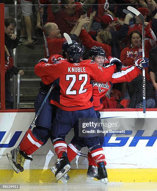 Nicklas Backstrom of the Washington Capitals scores in overtime and is joined by Mike Knuble and Alex Ovechkin to defeat the Montreal Canadiens 6-5...