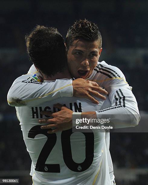 Gonzalo Higuain of Real Madrid celebrates with Cristiano Ronaldo after scoring Real's first goal during the La Liga match between Real Madrid and...