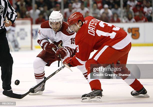 Matthew Lombardi of the Phoenix Coyotes battles for the puck with Pavel Datsyuk of the Detroit Red Wings during Game Three of the Western Conference...