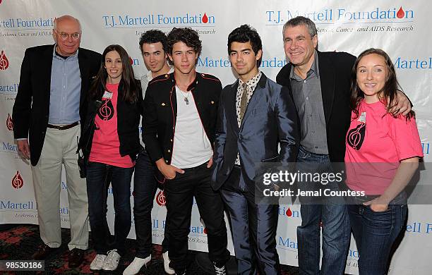 Martell Foundation CEO Peter Quinn, Elizabeth Alareo of the T.J. Martel Foundation, singers Kevin Jonas, Nick Jonas and Joe Jonas of the group, The...