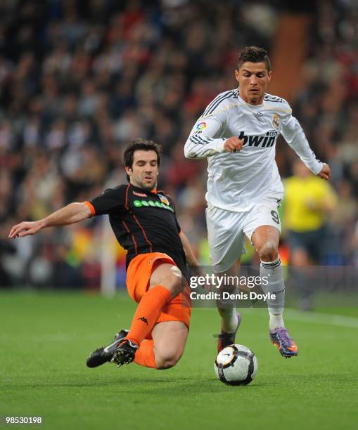 Cristiano Ronaldo of Real Madrid beats David Albelda of Valencia during the La Liga match between Real Madrid and Valencia at Estadio Santiago...