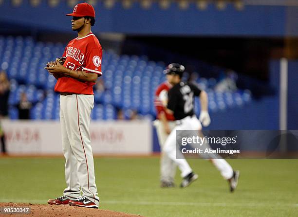 Adam Lind of the Toronto Blue Jays rounds the bases after a home run off of Ervin Santana of the Los Angeles Angels of Anaheim during a MLB game at...