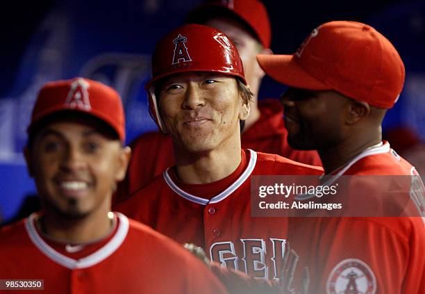 Hideki Matsui of the Los Angeles Angels of Anaheim is congratulated after a rbi double against the Toronto Blue Jays during a MLB game at the Rogers...