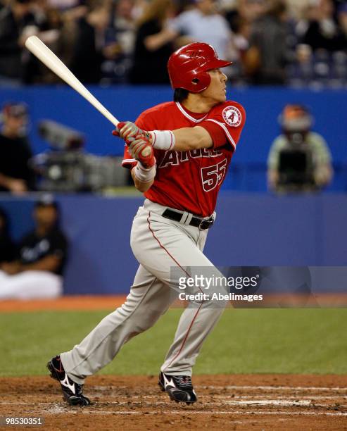 Hideki Matsui of the Los Angeles Angels of Anaheim hits a rbi double against the Toronto Blue Jays during a MLB game at the Rogers Centre April 18,...