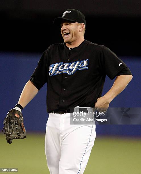 Lyle Overbay of the Toronto Blue Jays jokes around while playing the Los Angeles Angels of Anaheim during a MLB game at the Rogers Centre April 18,...