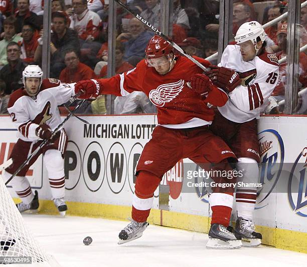 Niklas Kronwall of the Detroit Red Wings tries to control the puck next to Matthew Lombardi of the Phoenix Coyotes during Game Three of the Western...