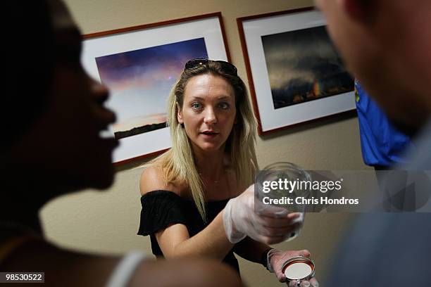 Beatriz Herrera-Rodden shows off some of her marijuana samples at the Cannabis Crown 2010 expo in Aspen, Colorado. Herrera-Rodden runs Soverign...