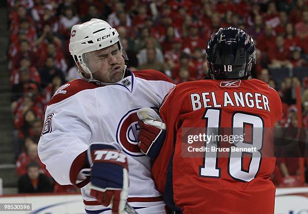 Jaroslav Spacek of the Montreal Canadiens hist Eric Belanger of the Washington Capitals in Game Two of the Eastern Conference Quarterfinals during...