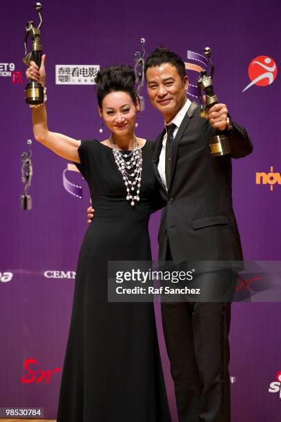 Actor Simon Yam , winner of the Best Actor awad, poses backstage with actress Kara Hui Yin-Hung, winner of the Best Actress award, at the 29th Hong...