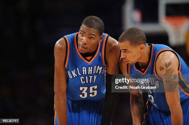 Kevin Durant and Thabo Sefolosha of the Oklahoma City Thunder look on against the Los Angeles Lakers in Game One of the Western Conference...